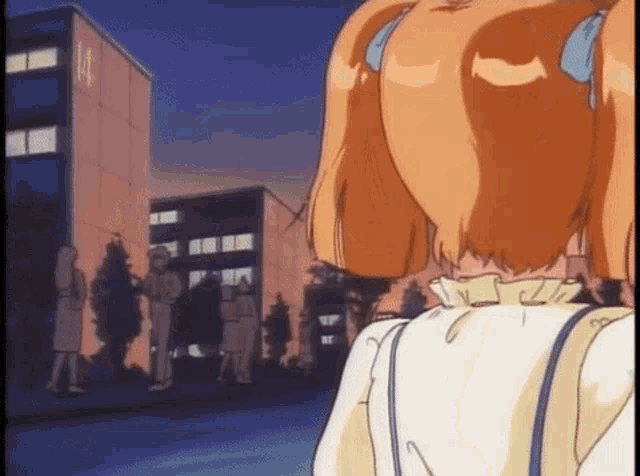 a girl in a white dress is standing in front of a group of people .
