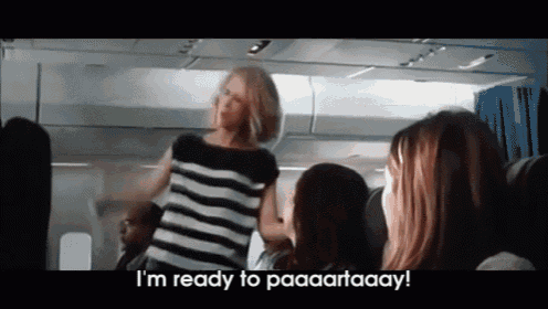 a woman in a striped shirt says i 'm ready to paaaartaay