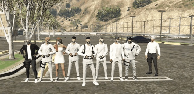 a group of people standing in a parking lot with one wearing a shirt that says ' aoa ' on it