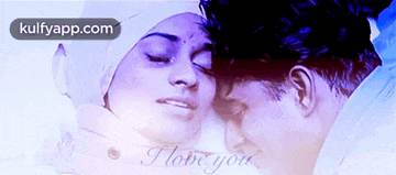 a man kissing a woman on the forehead with the words " i love you " written on the bottom