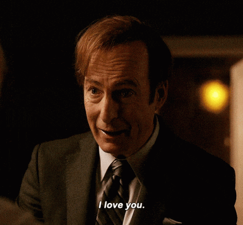 a man in a suit says i love you