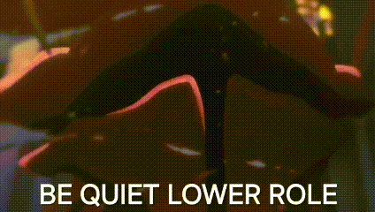 a close up of a person 's face with the words `` be quiet lower role '' .