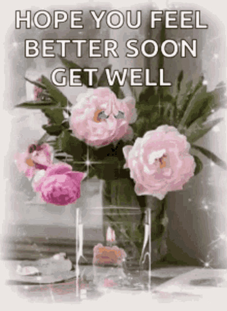 a bouquet of pink flowers in a vase with the words `` hope you feel better soon get well ''
