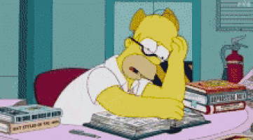a cartoon of homer simpson sitting at a desk with books