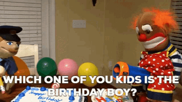 a clown and a police officer are sitting at a birthday cake