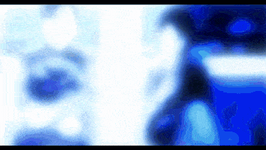 a blue and white background with a blurred image