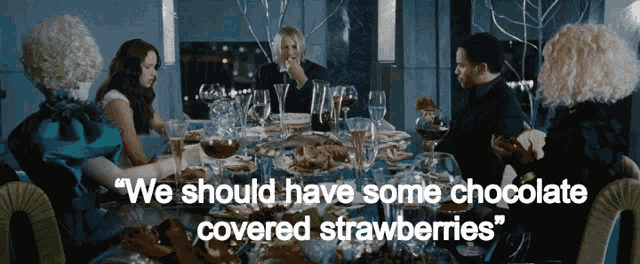 The Hunger Games Effie GIF - The Hunger Games Effie Maybe We Should Have Some Chocolate Covered Strawberries GIFs