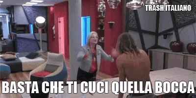 a man and a woman are dancing in a room with the words basta che ti cuci quella bocca written on the bottom