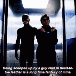 two men are standing next to each other in an elevator with a caption that says being scooped up
