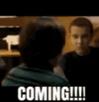 a man and a woman are talking to each other and the man is saying `` coming ! ''