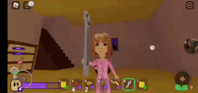 a girl in a pink shirt is playing a video game on a phone .