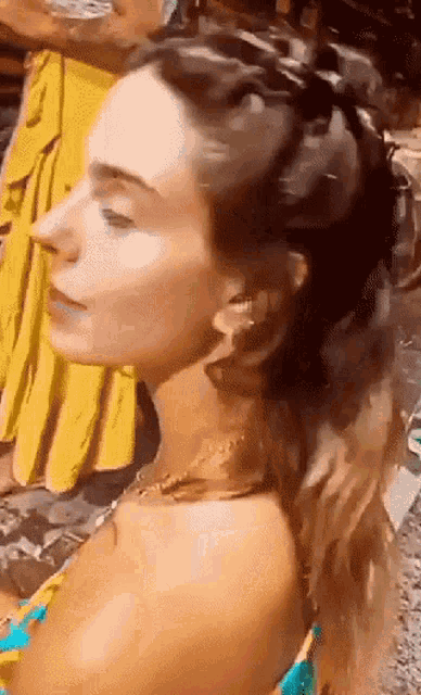 a close up of a woman 's face and hair