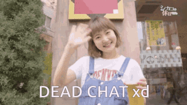 a woman is holding a beer and waving in front of a building with the words dead chat xd written on the bottom