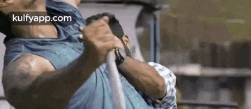 a man is holding another man 's neck while they are fighting .