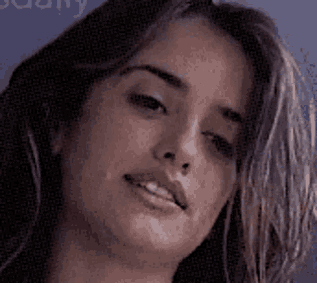 a close up of a woman 's face with the word beauty visible