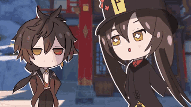 a boy and a girl are standing next to each other with one wearing a top hat with the letter f on it