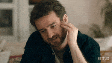 a close up of a man 's face with netflix written on the bottom right