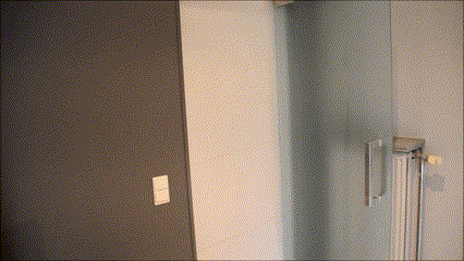 a door with a light switch on it and a radiator on the wall