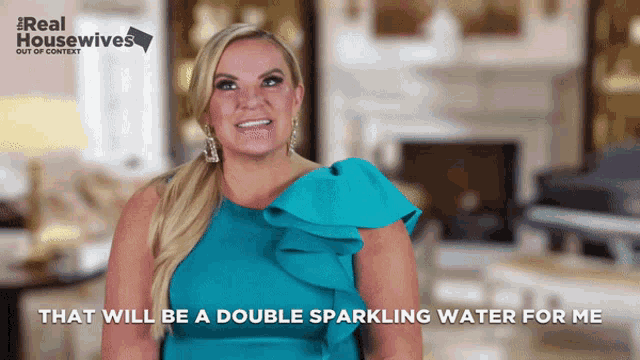 a woman in a blue dress says that will be a double sparkling water for her
