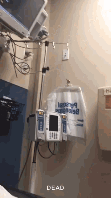 a hospital room with a bag that says dead