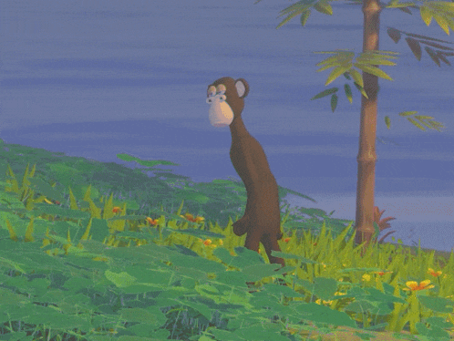 a monkey is hanging upside down from a tree