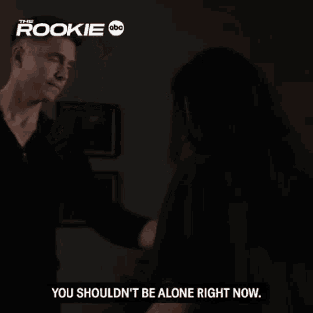 a man and a woman are standing next to each other and the man is saying you shouldn 't be alone right now