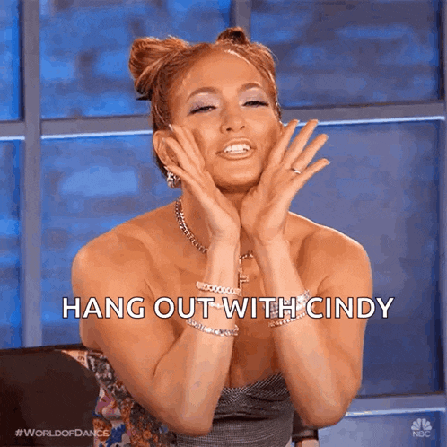 a woman with her hands on her face and the words hang out with cindy