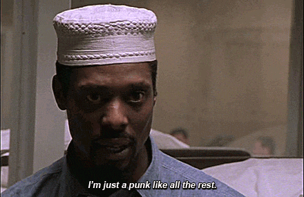 a man is wearing a white hat and says i 'm just a punk like all the rest