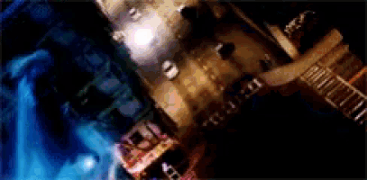 a blurred image of a city street at night with a blue background