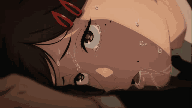 a close up of a girl 's face with tears coming out of it