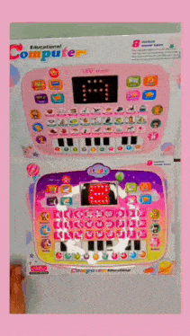a pink and purple educational computer with a led screen