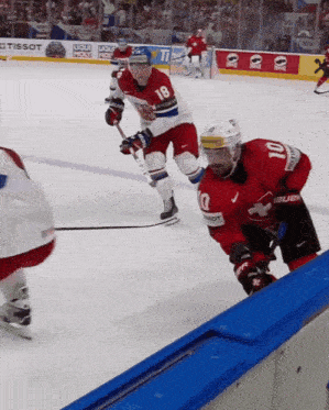 a hockey player in a red jersey with the number 10