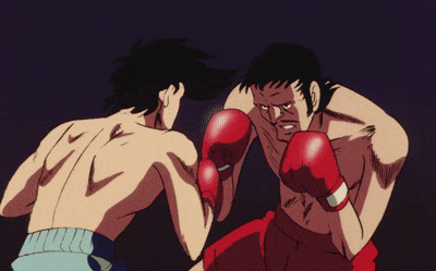 two men in red boxing gloves fighting each other