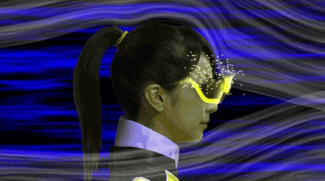 a woman with a ponytail is wearing a pair of goggles