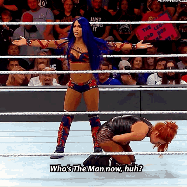 a woman in a wrestling ring asks who 's the man now