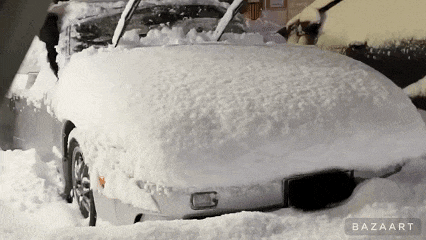 a car is covered in snow and the word bazaart is on the bottom of the image