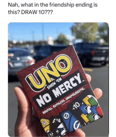 a person is holding a box of uno no mercy playing cards