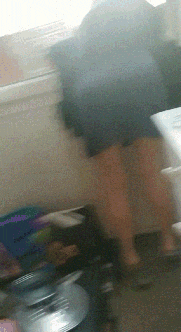 a blurry picture of a person standing next to a box that says ' a ' on it