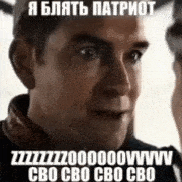 a man with a foreign language on his face is smiling