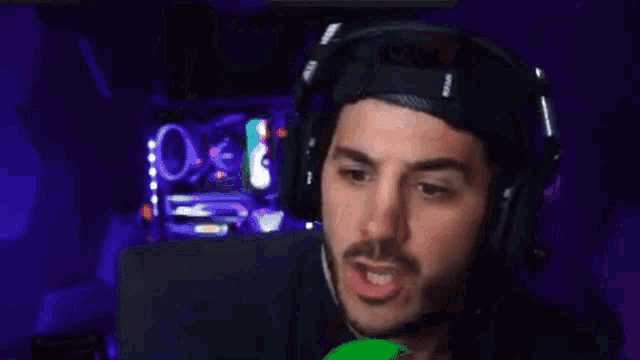 a man wearing headphones and a hat with the word me on it
