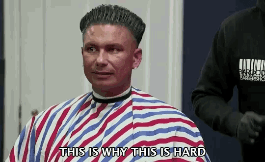 a man getting his hair cut at a barber shop with the words this is why this is hard below him