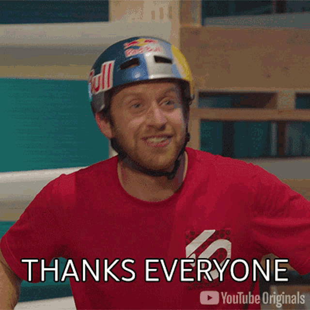 a man wearing a red shirt and a red helmet says thanks everyone on youtube