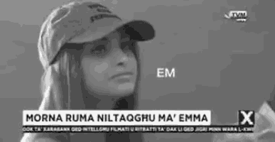 a black and white photo of a woman wearing a hat with the words morna ruma niltaqhu ma emma on it