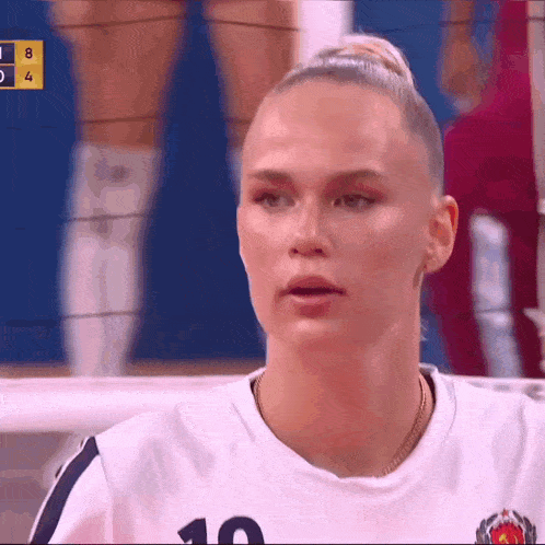 a female volleyball player wearing a number 10 jersey