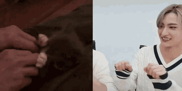 a close up of a person holding a cat 's paw next to a man holding a cat 's paw .