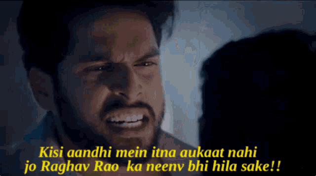 a man with a beard is looking at another man with the caption kisi aandhi mein itna aukaat nahi jo raghav rao