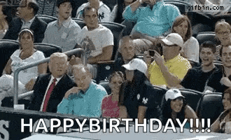 a group of people sitting in a stadium with the words happy birthday written on the bottom