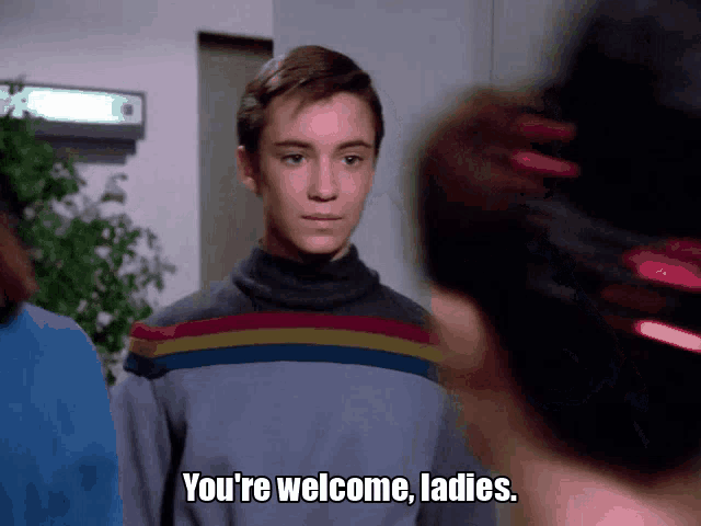 a man says " you 're welcome ladies " while standing next to a woman