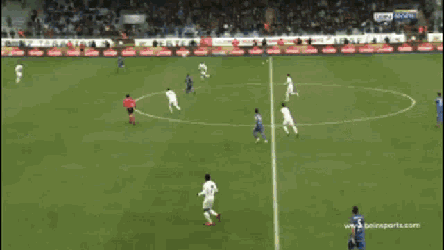a soccer player in a blue jersey with the number 23 jumps in the air