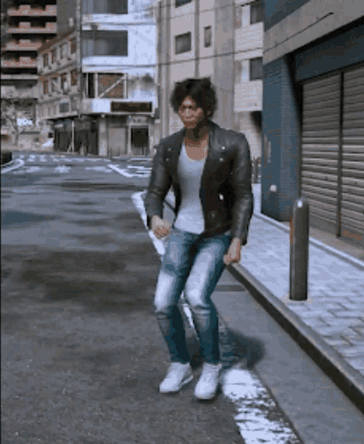 a man in a leather jacket and jeans is dancing on the street
